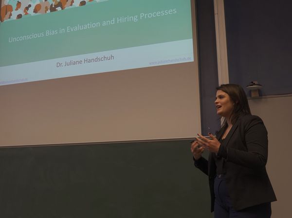Dr. Juliane Handschuh giving a talk about "Unconscious bias in evaluation and hiring processes"